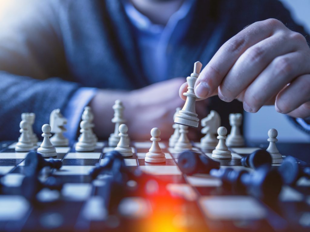 Close-up of a chess match in progress, representing strategic year-end planning